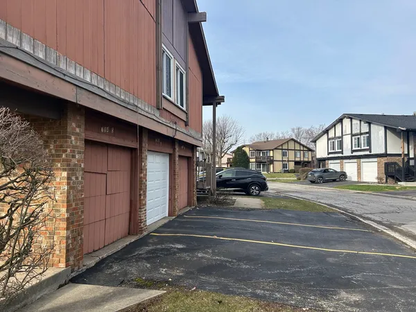 a view of street along with house and trees