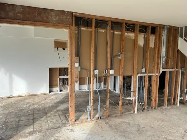 a view of an empty room with stairs