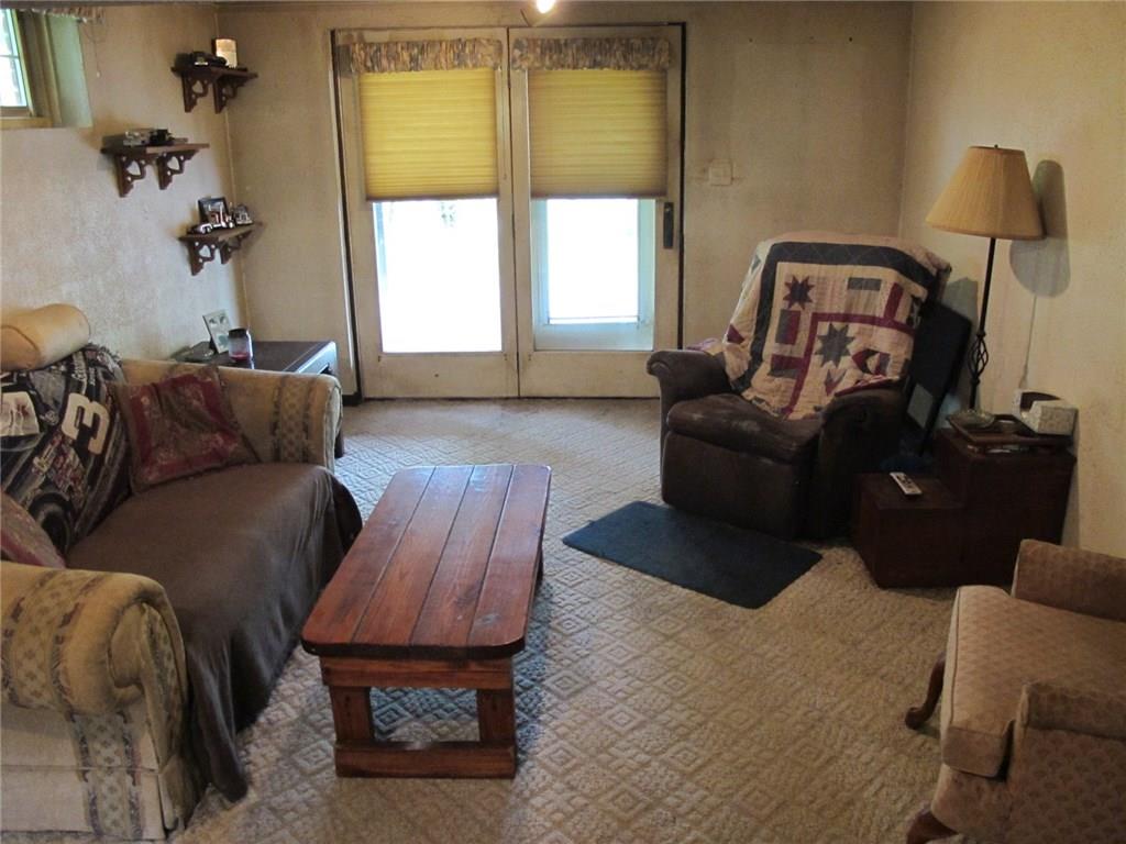 467 Crawford Run Road Cheswick, PA 15024 - Photo 14 of 24 Family room with wall-wall carpeting and atrium doors to patio