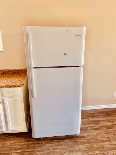 7409 Avenue L, Unit C Houston, TX 77011 - Photo 8 of 11 a white refrigerator freezer sitting next to a white wall