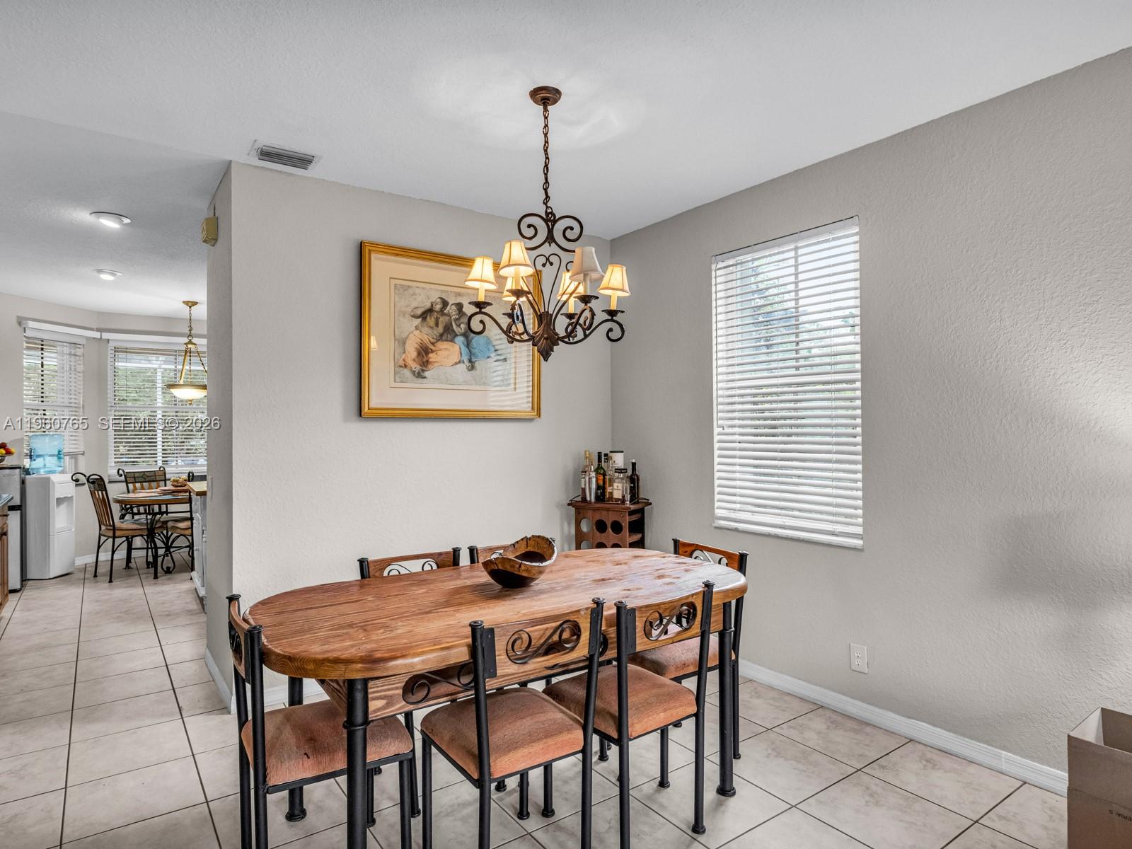 4209 Pinewood Lane Weston, FL 33331 - Photo 15 of 85 a dining room with furniture and window