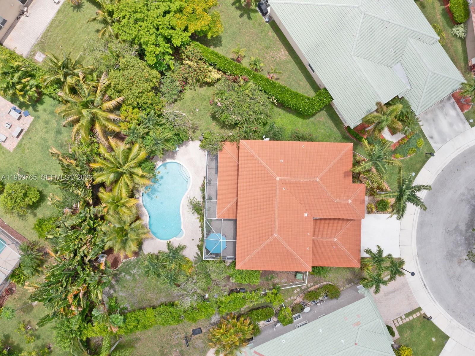 4209 Pinewood Lane Weston, FL 33331 - Photo 71 of 85 an aerial view of a house with a yard and a garden