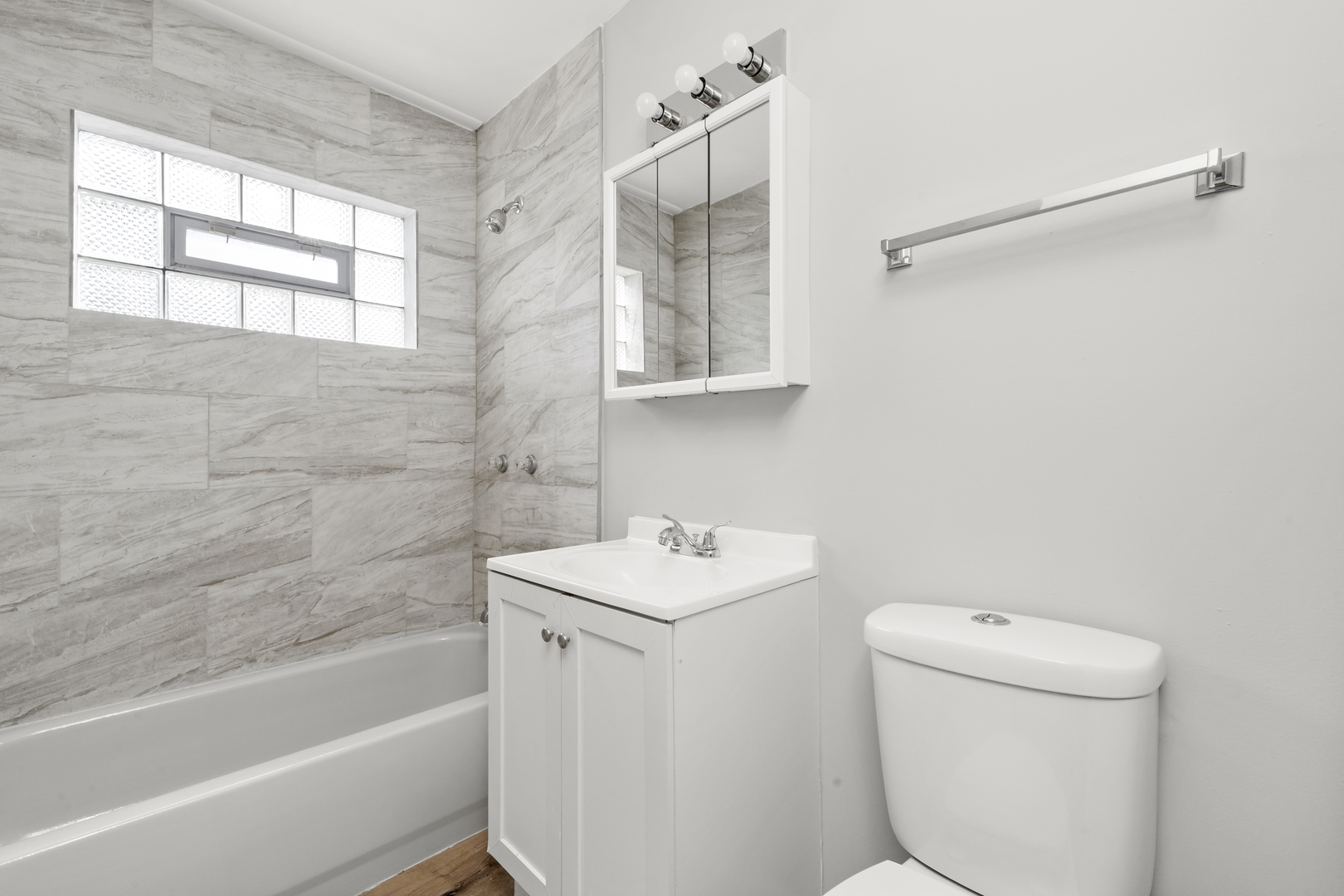 14618 Keystone Avenue Midlothian, IL 60445 - Photo 5 of 6 a bathroom with a sink toilet and shower