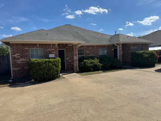 a view of a house with a yard and garage
