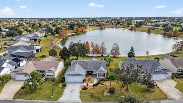 an aerial view of residential house with outdoor space and swimming pool