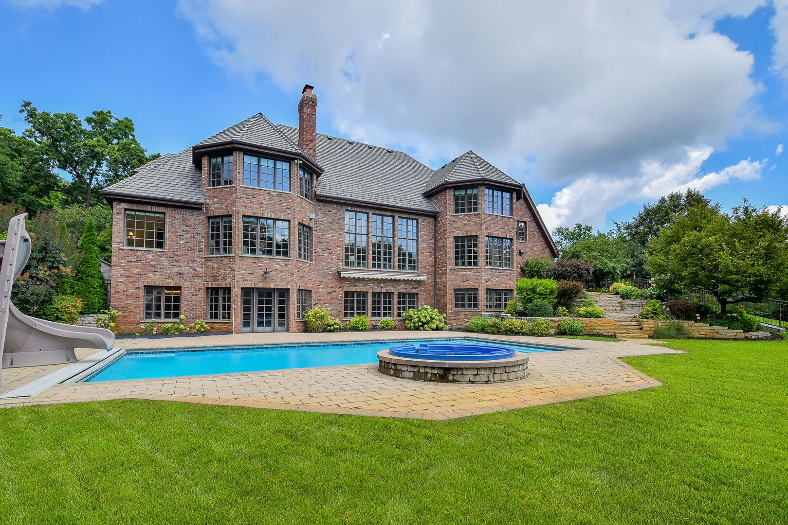 34W791 Army Trail Road Wayne, IL 60174 - Photo 54 of 65 a front view of building with yard and swimming pool