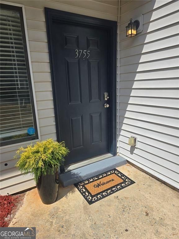 a view of entryway with potted plants