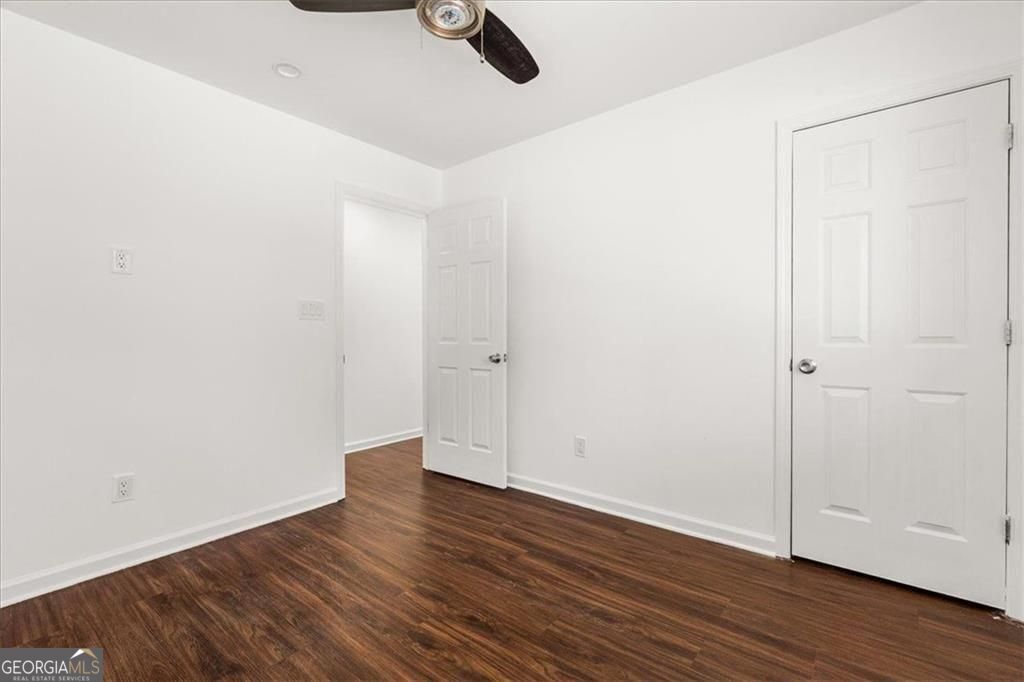 3755 Mulkey Road Marietta, GA 30008 - Photo 10 of 13 an empty room with wooden floor