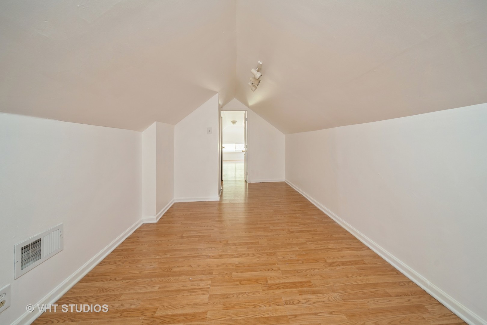 552 East 91st Place Chicago, IL 60619 - Photo 12 of 17 a view of an empty room with wooden floor