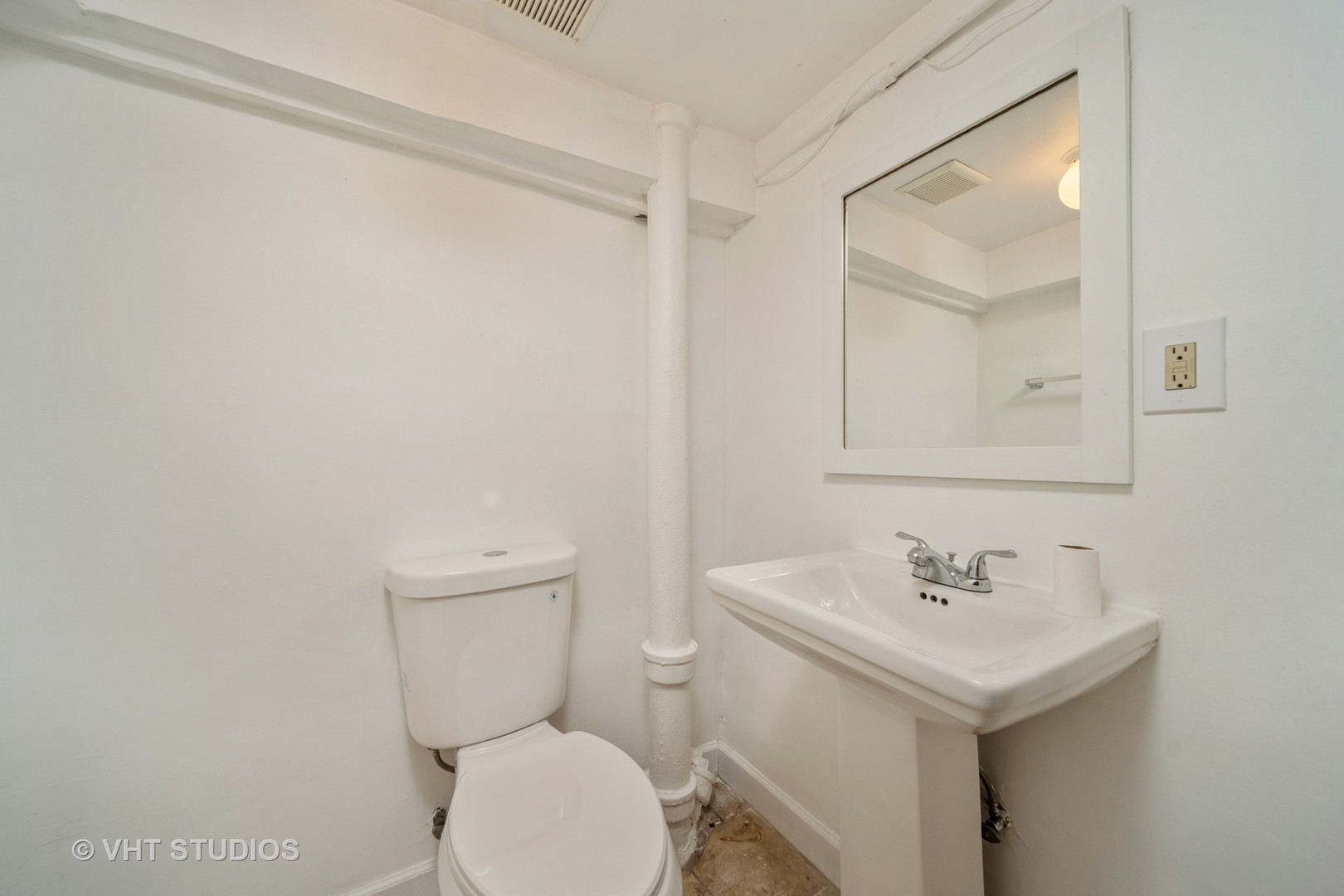 552 East 91st Place Chicago, IL 60619 - Photo 14 of 17 a bathroom with a sink a toilet and a mirror