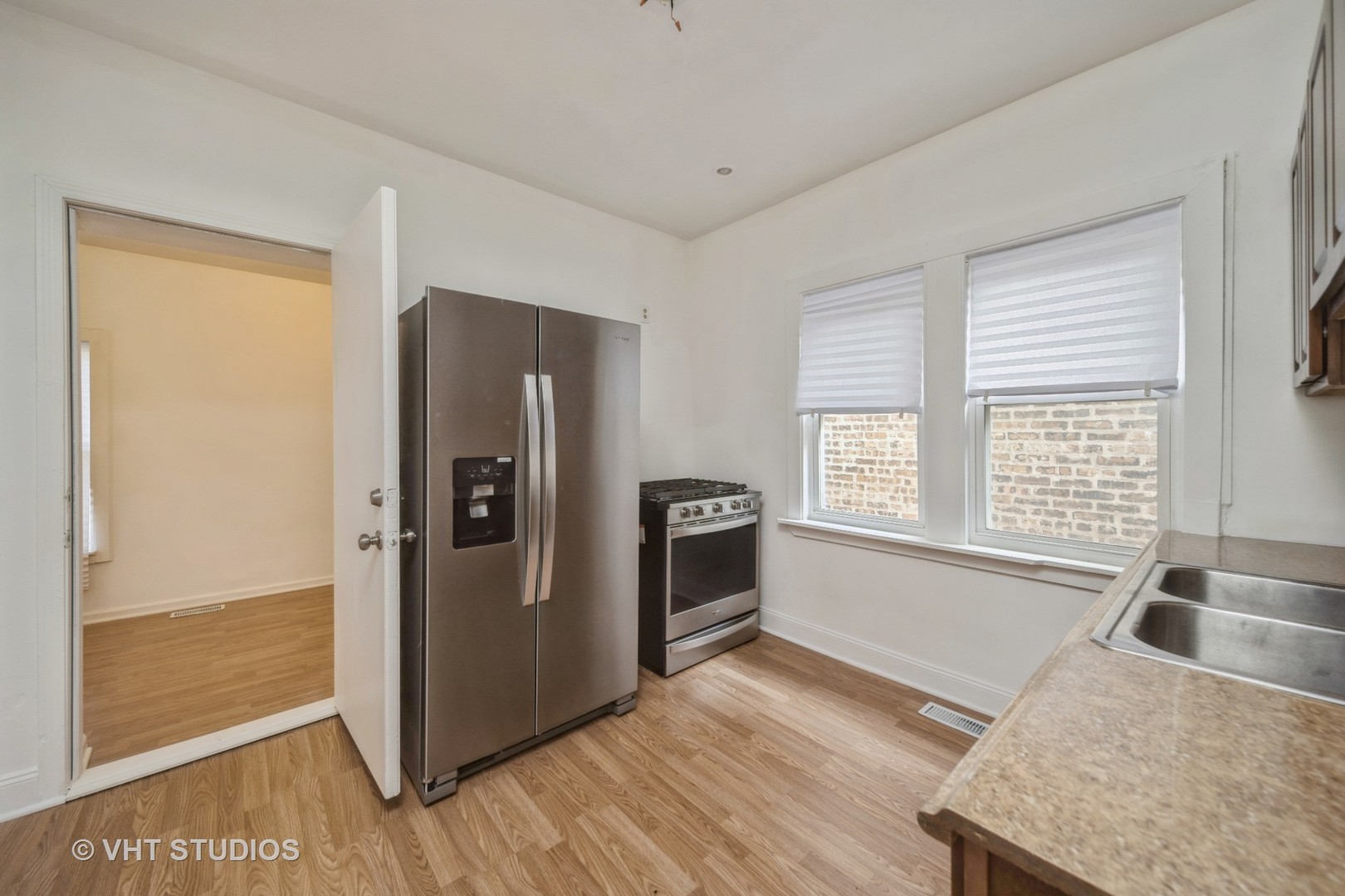552 East 91st Place Chicago, IL 60619 - Photo 6 of 17 a kitchen with stainless steel appliances granite countertop a refrigerator and a sink
