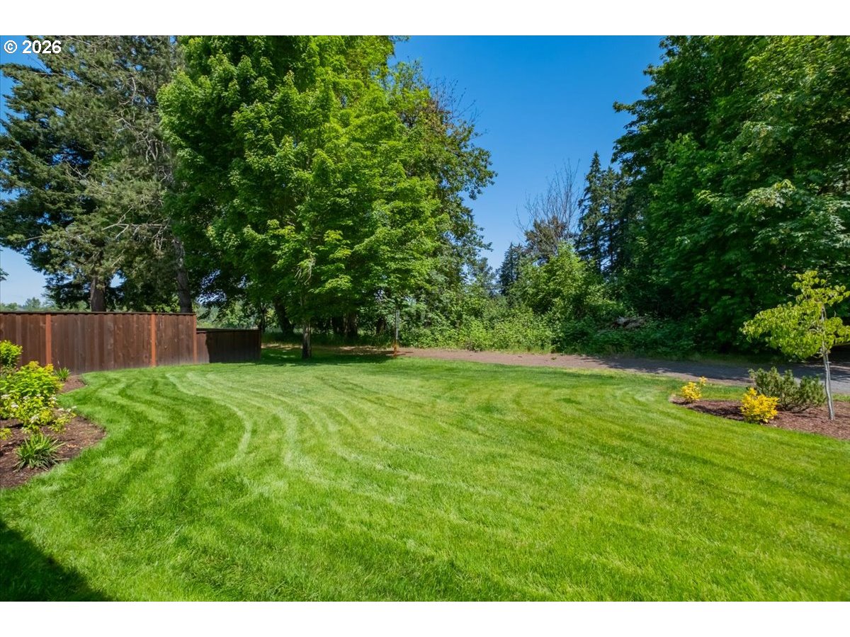 2147 Northeast Spitz Road Canby, OR 97013 - Photo 45 of 48 a view of a backyard with a garden