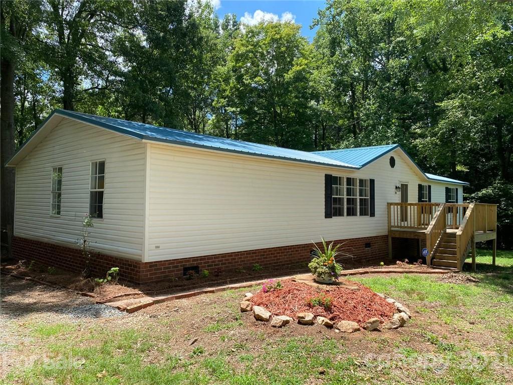 2811 Price Rushing Road Monroe, NC 28110 - Photo 3 of 34 a front view of a house with a yard