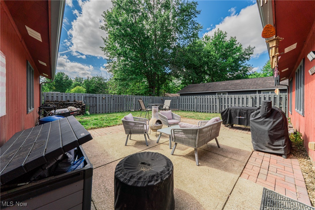 10794 Waterfall Road Strongsville, OH 44149 - Photo 30 of 37 Fenced backyard with a patio, outdoor lounge area, and a grill