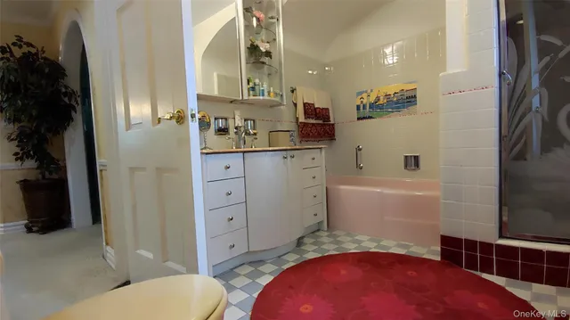 a kitchen with a refrigerator a sink and a window