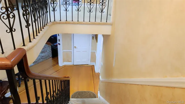 a view of an entryway with wooden floor
