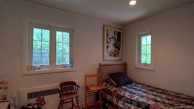 a kitchen with a refrigerator and potted plant