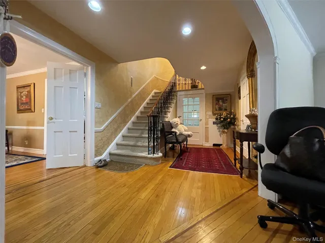 a view of a livingroom with furniture and stairs
