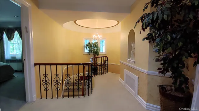 a bedroom with a bed and a flat tv screen