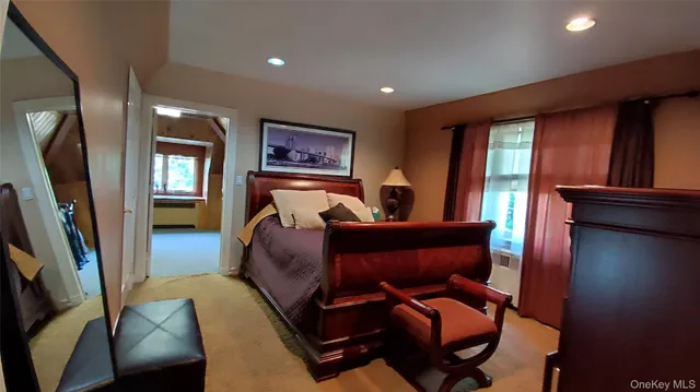 a view of staircase with railing and white walls