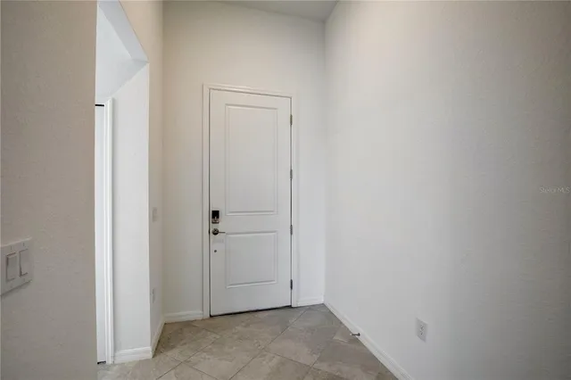 an empty room with closet area