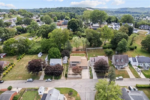 an aerial view of a house with a garden