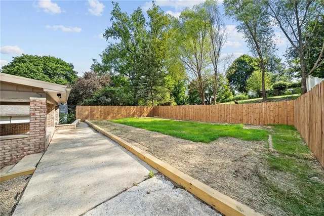 a view of backyard with green space