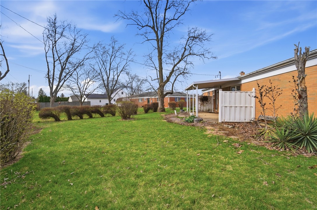 1087 Fairfield Road Troy, OH 45373 - Photo 39 of 39 This spacious backyard offers a perfect canvas for outdoor living and entertaining.