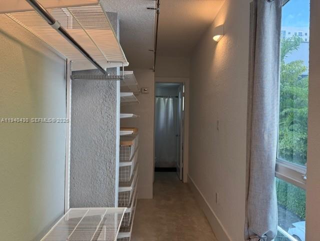 150 Southwest 10th Street, Unit 7 Miami, FL 33130 - Photo 11 of 15 a view of walk in closet with windows