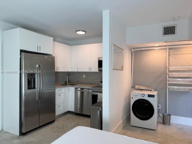 150 Southwest 10th Street, Unit 7 Miami, FL 33130 - Photo 13 of 15 a kitchen with stainless steel appliances granite countertop a refrigerator and a sink