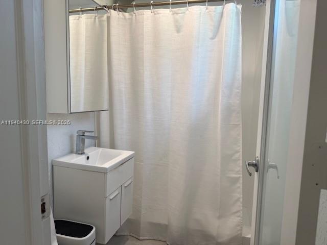 150 Southwest 10th Street, Unit 7 Miami, FL 33130 - Photo 9 of 15 a bathroom with a sink a toilet and shower