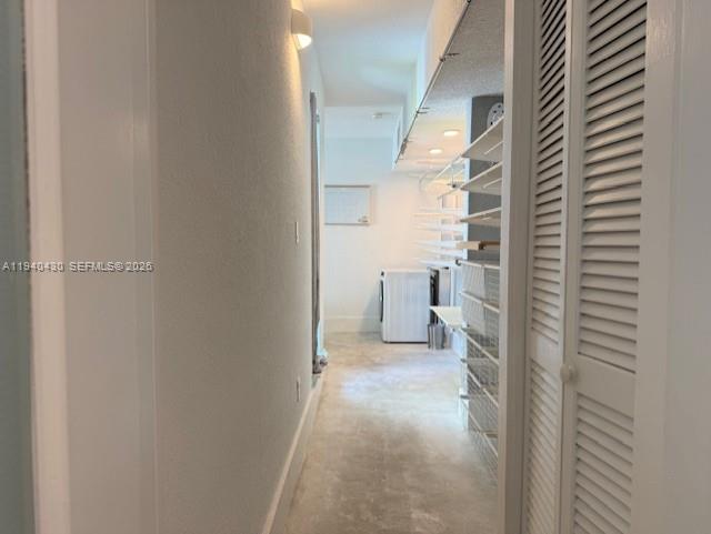 150 Southwest 10th Street, Unit 7 Miami, FL 33130 - Photo 10 of 15 a view of a hallway with wooden floor and a bathroom