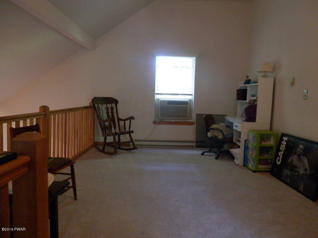 621 Silver Lake Road Dingmans Ferry, PA 18328 - Photo 9 of 14 a view of a room with gym equipment