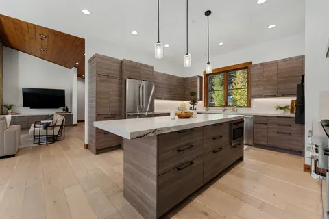 a bathroom with a double vanity sink and a large mirror