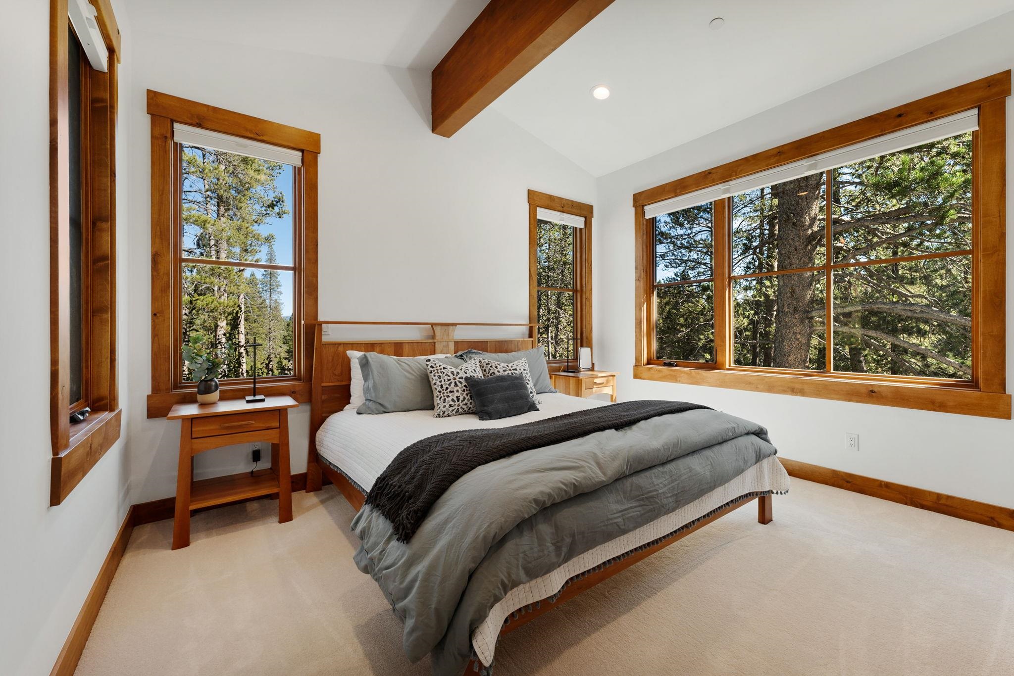 11791 Ghirard Road Truckee, CA 96161 - Photo 18 of 28 a bedroom with a large bed and a large window