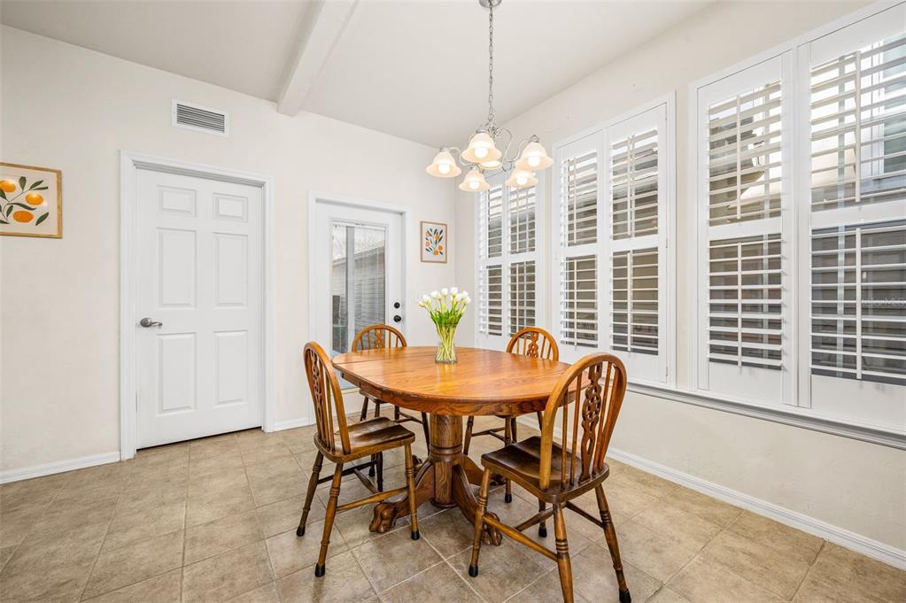 11550 Northwest 17 Place Gainesville, FL 32606 - Photo 14 of 48 a view of a dining room with furniture window and outside view