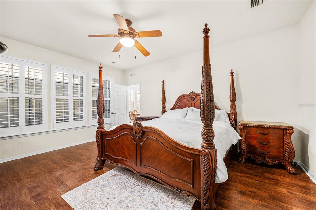 11550 Northwest 17 Place Gainesville, FL 32606 - Photo 16 of 48 a bed room with a bed and a chandelier