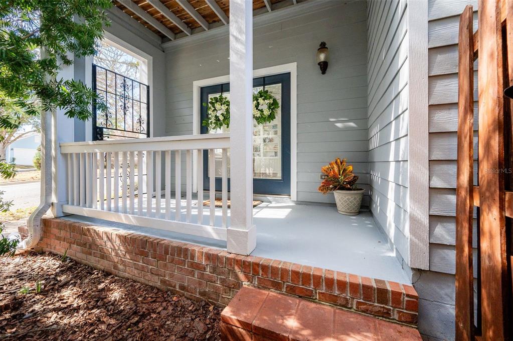 11550 Northwest 17 Place Gainesville, FL 32606 - Photo 2 of 48 a view of a porch with a bench