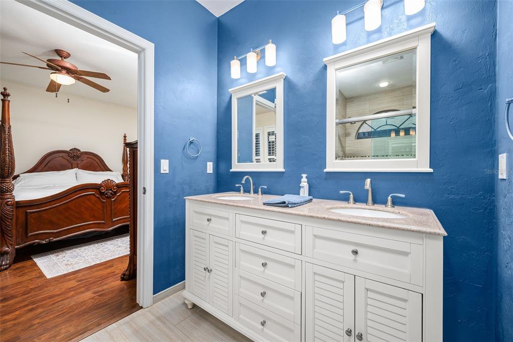 11550 Northwest 17 Place Gainesville, FL 32606 - Photo 21 of 48 a en suite bathroom with a sink and a mirror