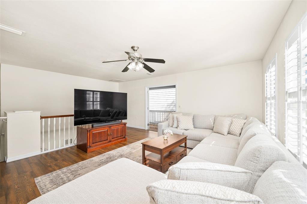 11550 Northwest 17 Place Gainesville, FL 32606 - Photo 24 of 48 a living room with furniture and a flat screen tv