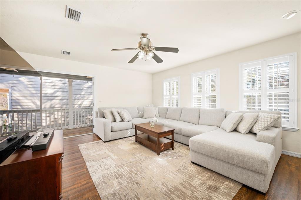 11550 Northwest 17 Place Gainesville, FL 32606 - Photo 25 of 48 a living room with furniture and large windows