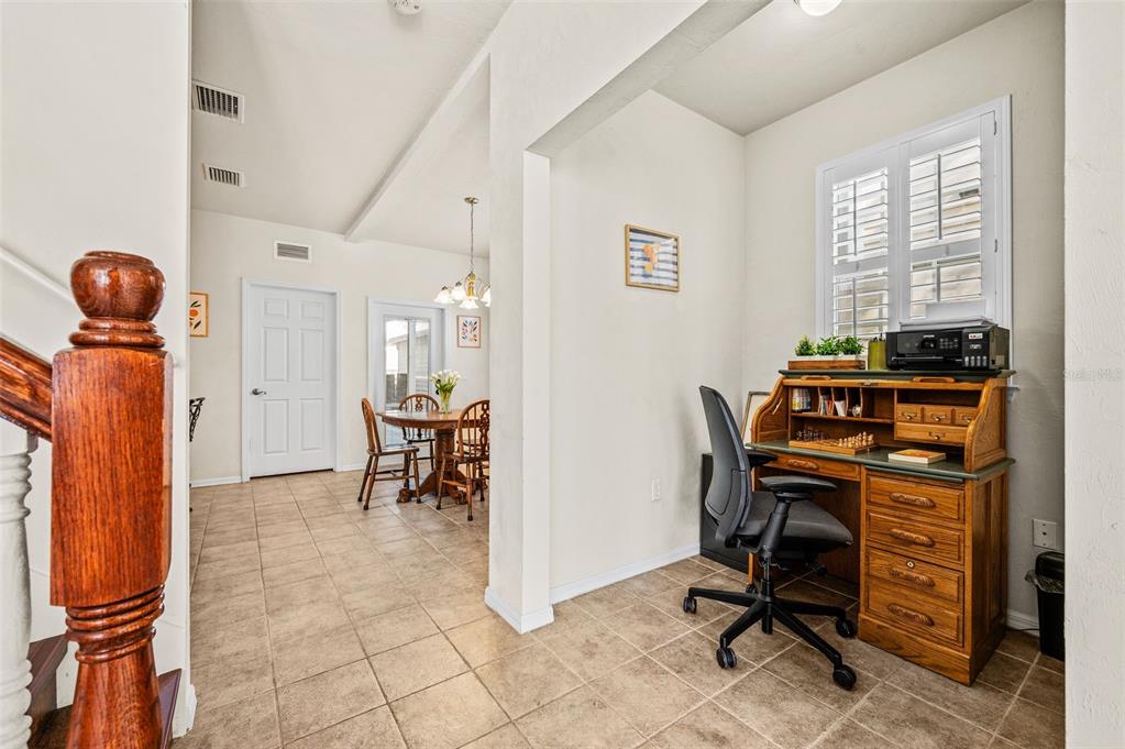 11550 Northwest 17 Place Gainesville, FL 32606 - Photo 7 of 48 a view of a workspace with furniture and a window