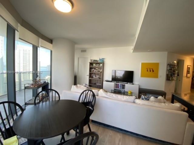 Brickell Heights II Miami, FL 33130 - Photo 9 of 12 a living room with furniture and a flat screen tv