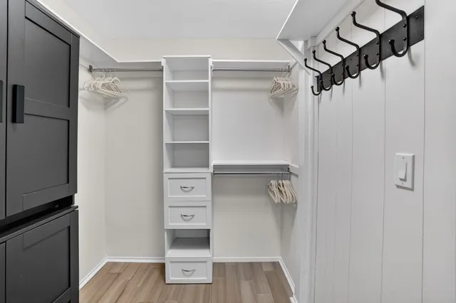 a backyard of a house with barbeque oven table and chairs