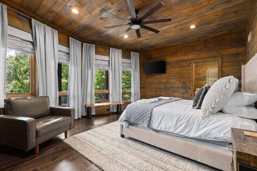 436 Geronimo Road Cherry Log, GA 30522 - Photo 45 of 58 a bedroom with a bed couch and a large window