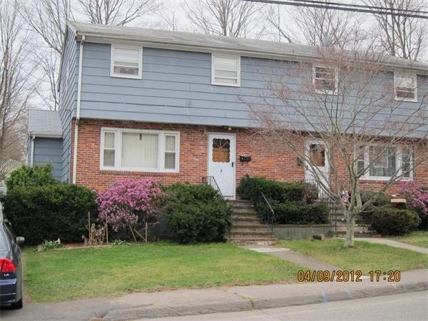 7 Raechel Road, Unit 7 Randolph, MA 02368 - Photo 1 of 23 a front view of a house with garden