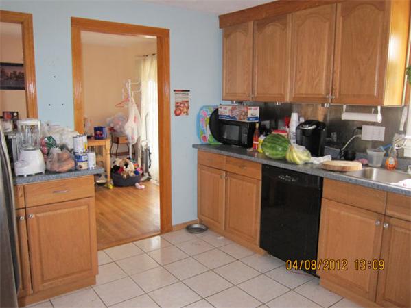 7 Raechel Road, Unit 7 Randolph, MA 02368 - Photo 8 of 23 a kitchen with stainless steel appliances a refrigerator sink and cabinets