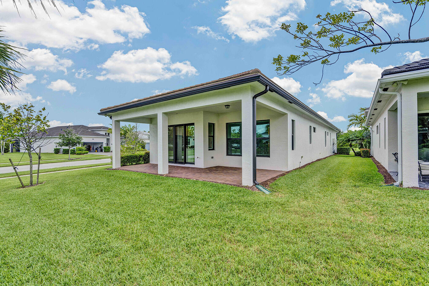 5501 Santa Rosa Lane Westlake, FL 33470 - Photo 24 of 31 a view of a house with backyard