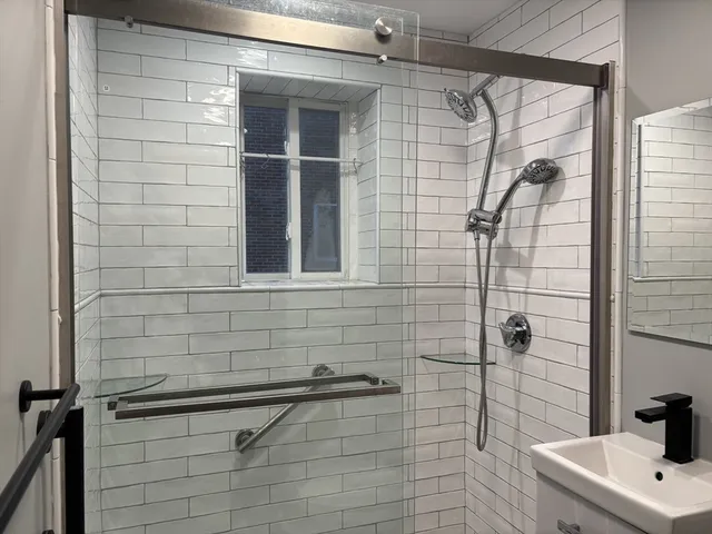 a bathroom with a sink and shower