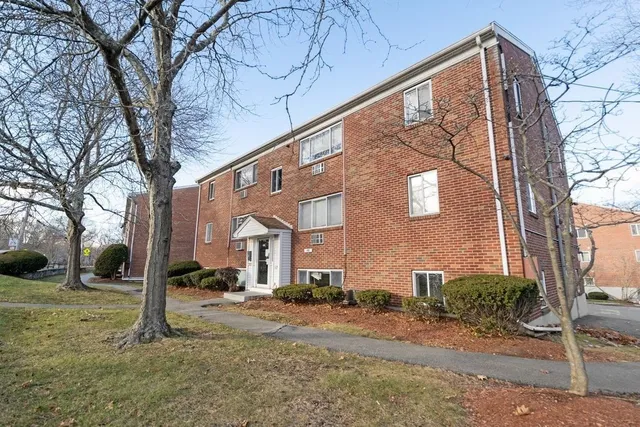 a view of a building with a yard